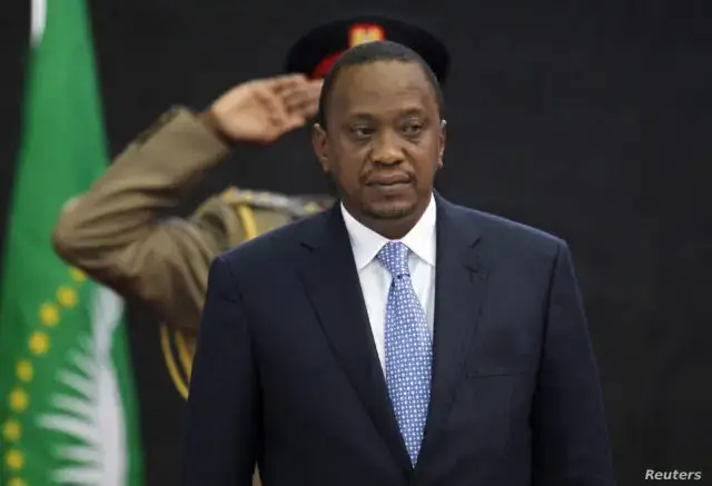Kenya's President Kenyatta stands for Kenya's national anthem before the Africa Union Peace and Security Council Summit on Terrorism at the Kenyatta International Convention Centre in Nairobi